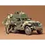 A 1/35 scale Tamiya model of a U.S. M16 half-track vehicle with painted crew figures, displayed against a plain brown background.