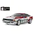 A studio shot of a Tamiya TT-02 Toyota GT-Four ST165 RC rally car with a white and red pre-painted body, featuring racing decals and white O.Z. Racing wheels.