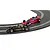 Two 1/32 scale Scalextric Formula 1 slot cars racing on a curved track, featuring a black John Player Special and a red Parmalat Alfa Romeo.
