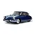 A studio shot of a Tamiya 1/10 scale Citroen DS RC car model in dark blue, featuring chrome bumpers and detailed wheels on a white background.