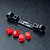 MST black aluminium adjustable suspension pin mount with four red plastic inserts on a black textured surface.