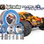 A collection of metal ball bearings with blue rubber seals arranged in front of an orange HPI Bullet Flux RC monster truck.