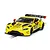 A Scalextric 1/32 scale Aston Martin GT3 Vantage slot car in bright yellow with Penny Homes Racing livery on a track section.