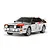 A 1/10 scale Tamiya Audi Quattro A2 RC car model, featuring a white, brown, and red rally livery with number 3 on the side, isolated on a white background.