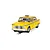 A 1/32 scale Scalextric 1977 NYC Taxi slot car in yellow, featuring a checkerboard pattern and driver figure, positioned on a slot car track.