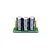 Castle Creations 8S capacitor pack featuring three cylindrical electrolytic capacitors mounted on a small green circuit board.