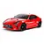 A studio shot of a 1/10 scale Tamiya Toyota GR 86 RC car kit, featuring a bright red body, black wheels, and detailed front grille with GR branding.