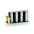 Castle Creations 8S capacitor pack featuring four black electrolytic capacitors mounted on a green circuit board with gold-plated terminals.