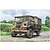 A detailed illustration of a military Chevrolet 15 CWT truck parked on a rural road, featuring camouflage paint and D-Day markings.