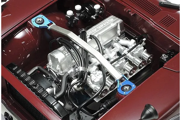 Engine room with triple carburettors and metal air funnels