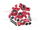 A set of red anodized aluminium front steering hubs and rear hubs for an RC car, including bearings, screws, and small black plastic spacers.