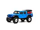 A blue Axial SCX24 Jeep Gladiator RC rock crawler viewed from the side against a white background.