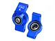 Two blue anodized aluminium RC rear hubs from GPM Racing, featuring pre-installed ball bearings and laser-etched markings.