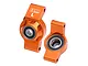 A pair of orange anodized aluminium rear hubs for RC cars by GPM Racing, featuring pre-installed ball bearings.