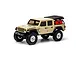 Axial SCX24 Jeep Gladiator RC rock crawler in beige, featuring a black roof, off-road tires, and a red fuel canister in the truck bed.