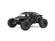 ARRMA Fireteam 6S BLX Speed Assault Vehicle in matte black camo finish, featuring a detailed roll cage, off-road tires, and three scale driver figures.