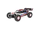 Losi Tenacity DB Pro 1/10 scale RC desert buggy in Lucas Oil livery, featuring a white, red, and blue body with off-road tires and a rear wing.