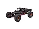 Losi Lasernut 2.2 4S RC Desert Buggy in black with red accents, featuring large off-road tires and copper-colored beadlock wheels on a white background.
