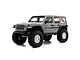 Studio shot of an Axial SCX10 III 2017 Jeep JLU Wrangler RC rock crawler in grey, featuring large off-road tires and detailed bodywork.