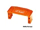 An orange anodized aluminium GPM Racing servo mount for RC vehicles, featuring a machined design with mounting holes and the GPM Racing logo.