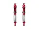 Two GPM Racing red anodized aluminium adjustable RC shock absorbers with silver springs against a white background.