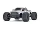 A white ARRMA Big Rock 6S BLX 4x4 RC monster truck viewed from a low front angle against a white background.