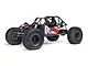Axial AXP8 Gilamon 2.2 RC rock crawler in red and white, featuring a roll cage, driver figure, and large off-road tires on a white background.