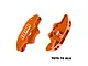 Two orange anodized aluminium RC brake calipers by GPM Racing, showing front and rear views with the GPM logo.