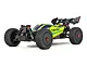 ARRMA Typhon 223S BLX 4WD electric brushless RC buggy in yellow with black wheels and rear wing on a white background.