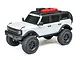 A white 1/24 scale Axial SCX24 2021 Ford Bronco RC rock crawler viewed from a high angle against a white background.
