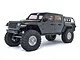 A grey Axial SCX10 III Jeep JT Gladiator RC rock crawler truck shown from a front three-quarter angle against a white background.