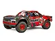 ARRMA MOJAVE 6S V2 BLX desert racer RC truck in red and black livery, featuring off-road tires and a detailed cockpit.