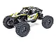 Axial UTB18 Capra 4WS RC rock crawler in yellow and black, featuring a tube chassis, off-road tires, and driver figures.