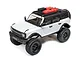 Axial SCX24 2021 Ford Bronco RC rock crawler in grey, featuring a black roof, roof rack with accessories, and off-road tires on a white background.
