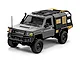 A grey MN Model Toyota LC79 RC rock crawler truck in 1/12 scale, featuring a black canopy, roof rack, and off-road tires on a white background.