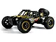 BlackZon Smyter DB Turbo 1/12 scale RC desert buggy in yellow and black with off-road tires and a spare tire mounted on the back.