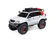 Axial SCX24 Lexus GX 470 RC rock crawler in white with off-road accessories, roof rack, and bronze wheels on a white background.