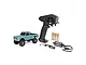 Axial SCX30 Chevrolet K10 RC rock crawler in green, including a Spektrum transmitter, four AA batteries, a LiPo battery, and a USB charger.