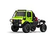 A lime green MN Model Unimog RC rock crawler truck with black roll cage, off-road tires, and illuminated headlights against a white background.