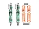 Two GPM Racing aluminium piggyback shock absorbers with green springs, plus four extra orange springs and four metal mounting pins on a white background.