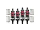 A set of four GPM Racing aluminium RC shock absorbers in red and black, with two additional loose springs on each side.