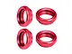 Four red anodized aluminium shock collars for RC cars, featuring a knurled outer edge and internal threading.