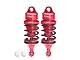 Two red GPM Racing aluminium adjustable RC shock absorbers with black springs, shown against a white background.