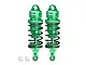 Two green GPM Racing aluminium adjustable RC shock absorbers with black springs and two small white plastic ball ends on a white background.
