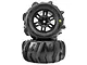 Two Pro-Line 1/16 Dumont MT paddle tyres pre-mounted on black split-six RC wheels, stacked vertically against a white background.
