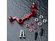 MST red anodized aluminium steering joint plate with included bearings, spacers, and screws on a dark textured surface.