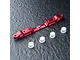 A red anodized aluminium MST adjustable lower suspension arm mount with four small white plastic bushings on a textured black surface.