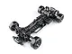 Top-down studio shot of the MST RMX 4 GT competition-level RC drift car chassis kit in black with carbon fiber components.