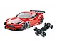 MST red GR86 RC drift car body with wide body kit and rear wing, shown alongside its black chassis on a white background.