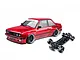 MST E30RB shiny red RC drift car body paired with a black RC car chassis on a plain white background.